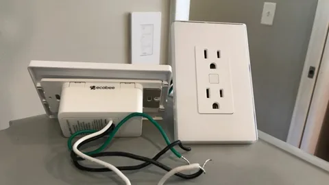 Professional electrician installing smart home wiring and structured cabling in a modern New Zealand home.